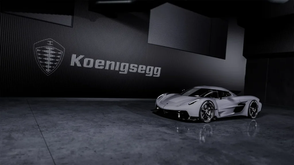 Conheça o carro mais rápido do mundo: dados oficiais e curiosidades 2 carro mais rápido do mundo - Koenigsegg Jesko Absolut em um estúdio com piso de concreto polido, sob iluminação suave e o logotipo da Koenigsegg ao fundo.